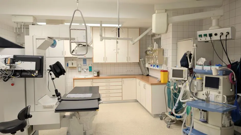 Spacious X-ray room equipped with advanced imaging technology.